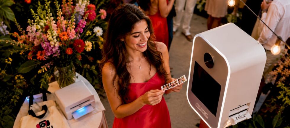 Guest using photo booth at wedding event