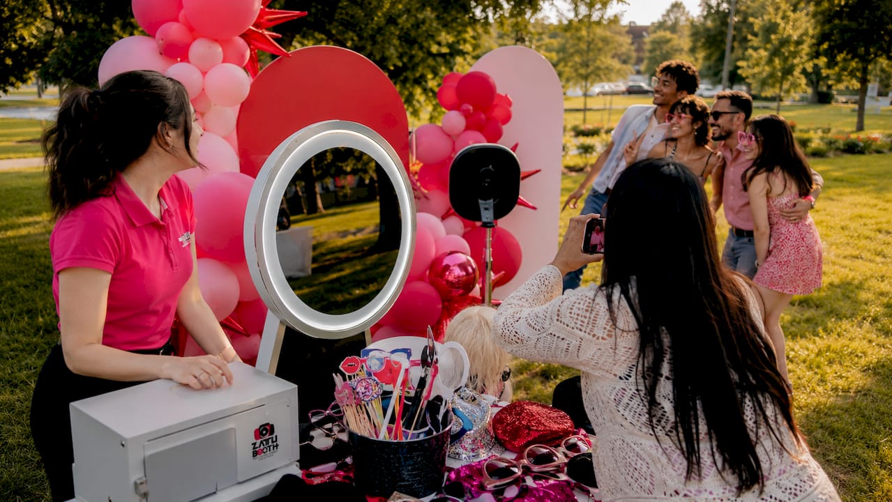 Guests engaging with ZATTU photo booth at event